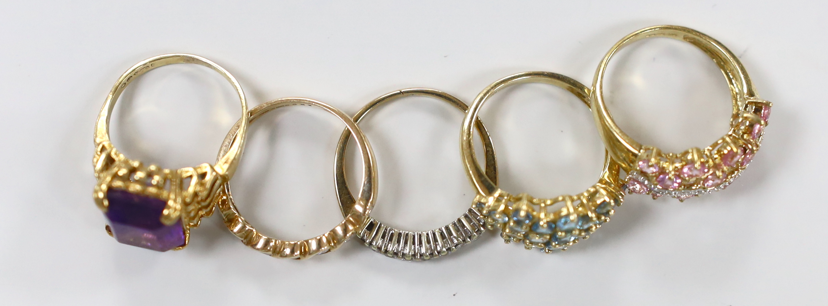 Five assorted modern 9ct gold and gem set rings, including two diamond set half hoop, gross weight 15.8 grams.